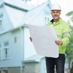 ADU Now LA contractor holding architectural plans for accessory dwelling unit construction in Los Angeles